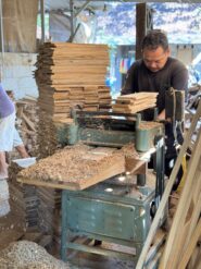 Craftsman Operating Thickener Machine Inside Precision Woodworking Workshop
