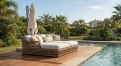 Rattan Daybed And Loungers Near Poolside Deck